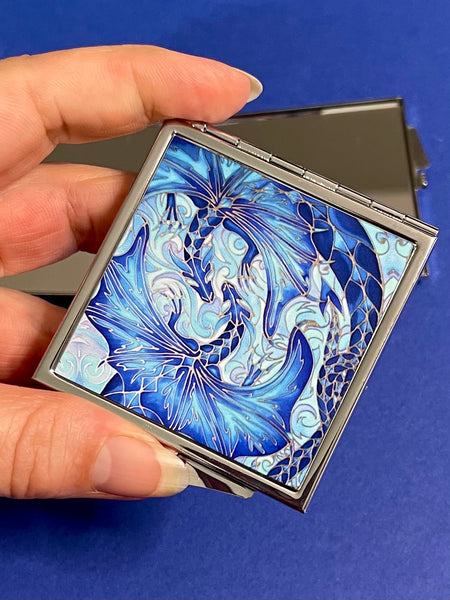 Blue dragon square mirror for, pocket, handbag, purse or desk drawer. Open the metal case to reveal two mirrors. Check your make up any time you need to.