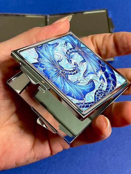 Blue dragon square mirror for, pocket, handbag, purse or desk drawer. Open the metal case to reveal two mirrors. Check your make up any time you need to.