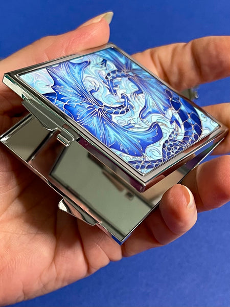 Blue dragon square mirror for, pocket, handbag, purse or desk drawer. Open the metal case to reveal two mirrors. Check your make up any time you need to.