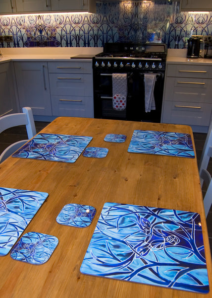 Blue Stag square table mats and matching coasters - hard wearing durable mats - 28x28cm  placemats in blue and aqua -gift for woodland, forest, tree and wildlife lovers. 
Square Stag place Mat - Stag Table Mats and Coasters 
Full wall stag glass splashback in background.
